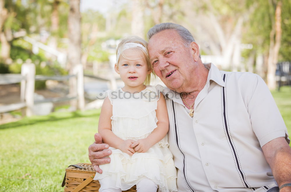 Similar – Image, Stock Photo Grandfather and grandson with a electric wheelchair