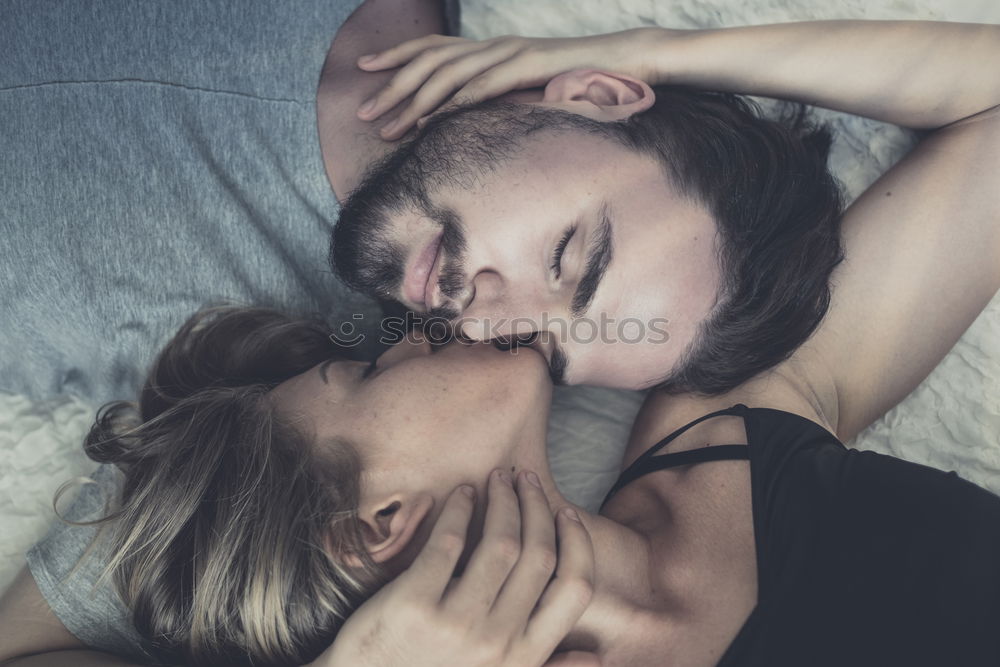 Similar – Boyfriend giving his girlfriend a kiss in the bed