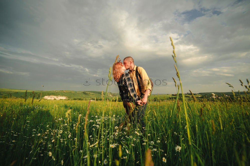 Happy man sitting on a pile of hay