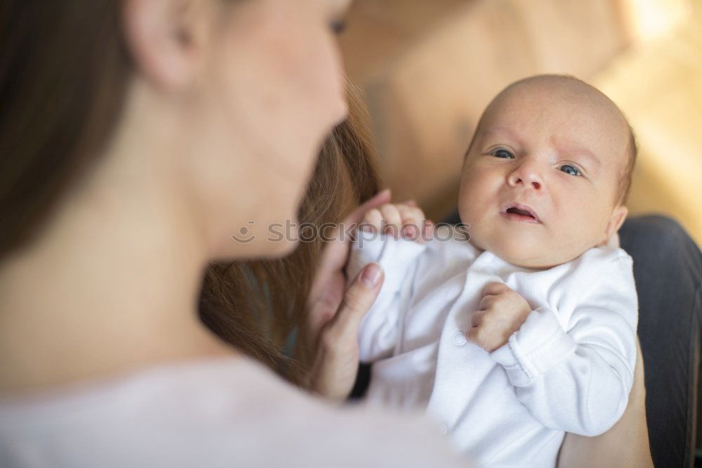 Similar – Image, Stock Photo Mother holding newborn baby son at the day time. Concept of happy family.