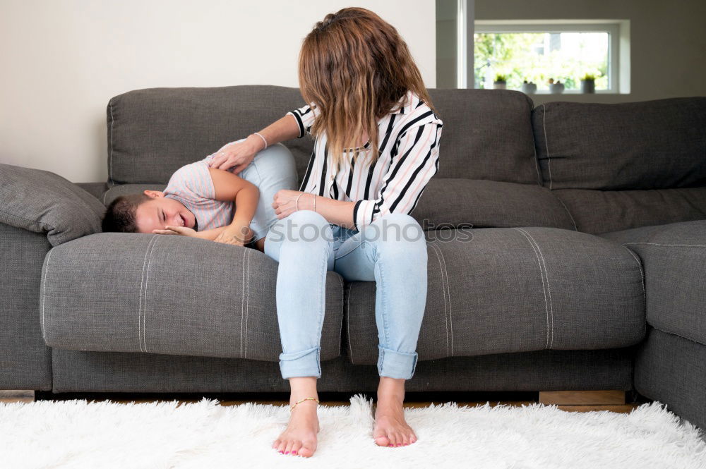 Similar – caucasian mother and son relaxing together on couch at home