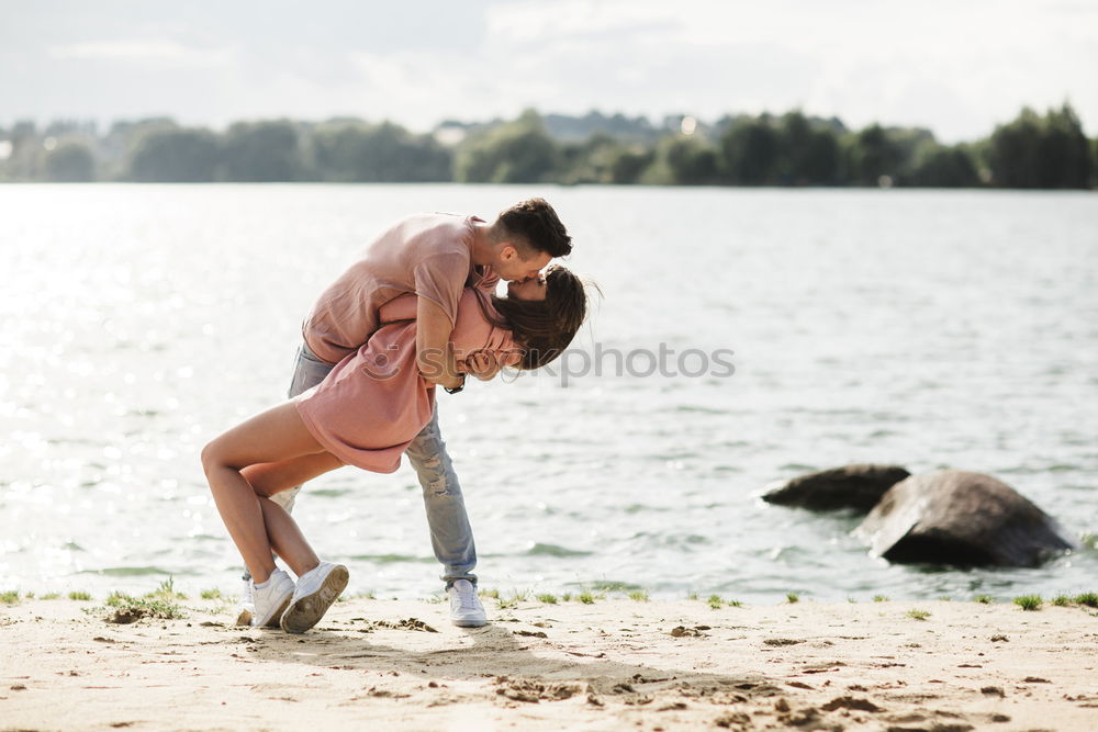 Similar – Image, Stock Photo Fitness couple kissing on the beach