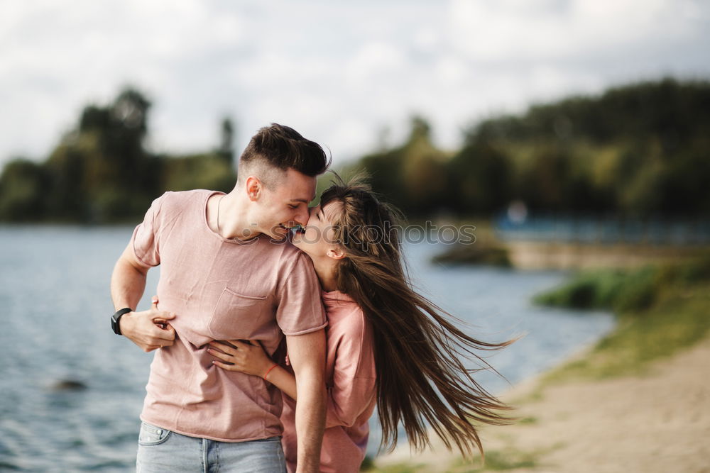 Similar – Image, Stock Photo Happy couple hugging and kissing near tree in park