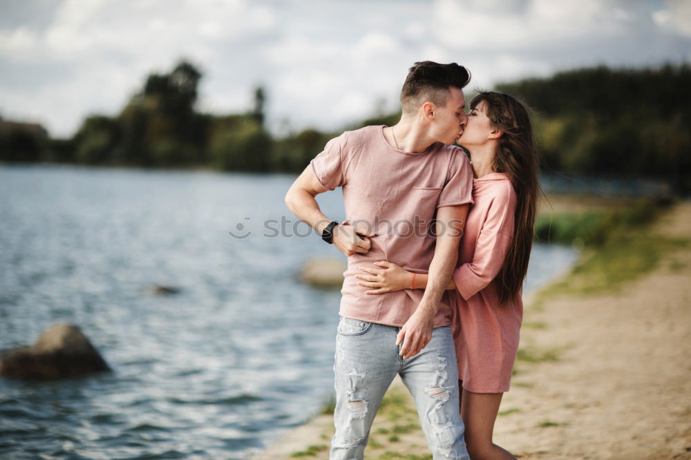 Similar – Image, Stock Photo Happy couple hugging and kissing near tree in park