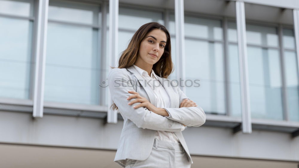 Image, Stock Photo Young businesswoman standing outside of office building