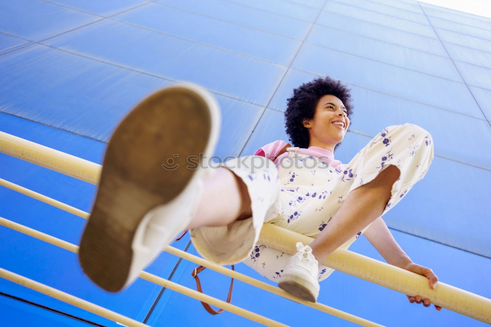 Similar – Woman with afro hair climbing by children’s attractions.