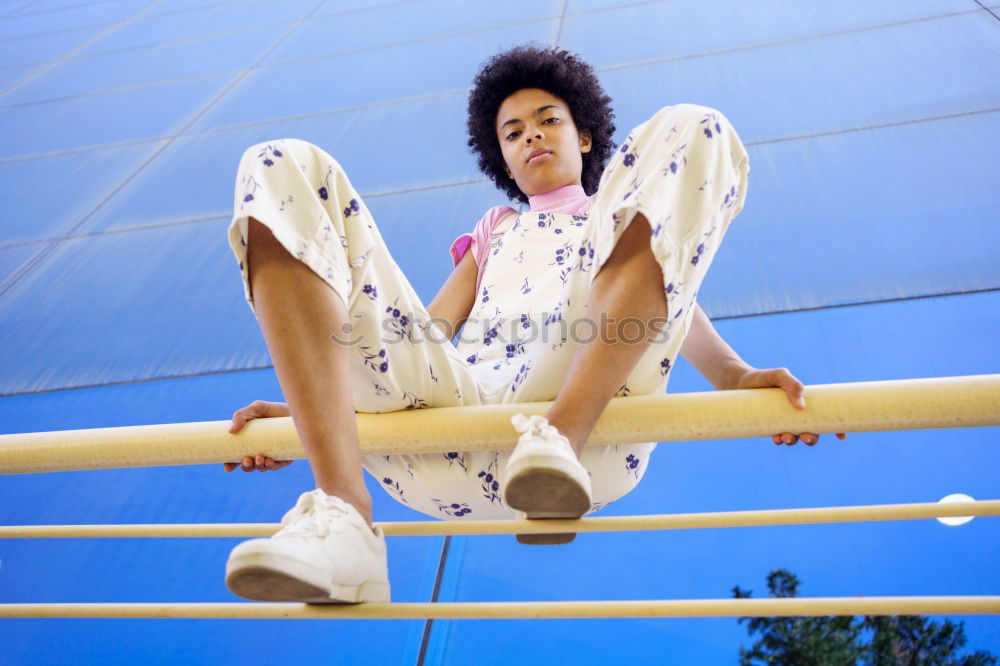 Similar – Woman with afro hair climbing by children’s attractions.