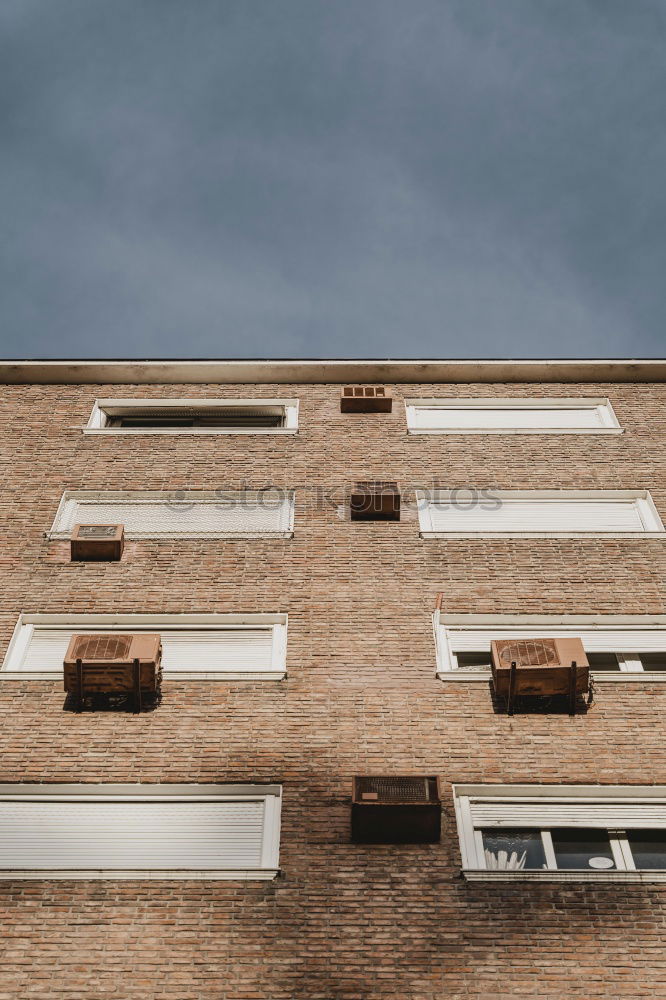 Similar – facade with rounding, plaster and brick