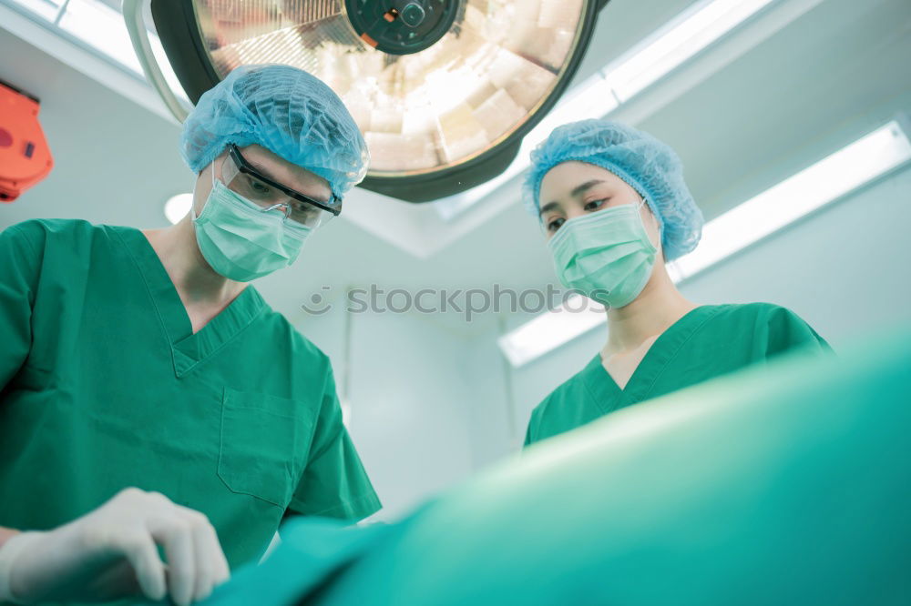 Similar – Image, Stock Photo Team of Surgeons Operating.