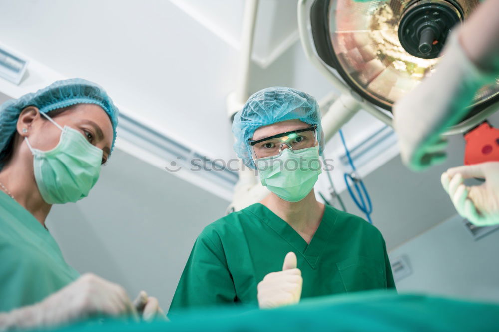 Similar – Image, Stock Photo Team of Surgeons Operating.