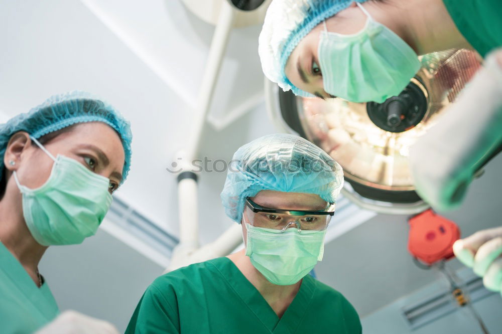 Similar – Image, Stock Photo Team of Surgeons Operating.