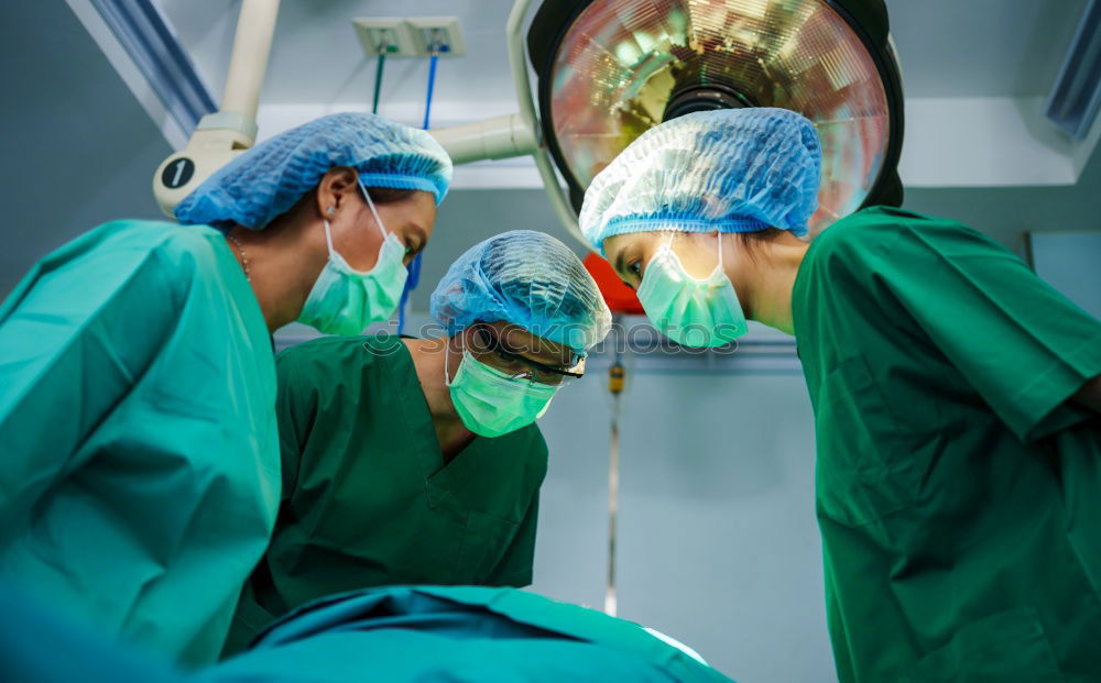 Image, Stock Photo Team of Surgeons Operating.