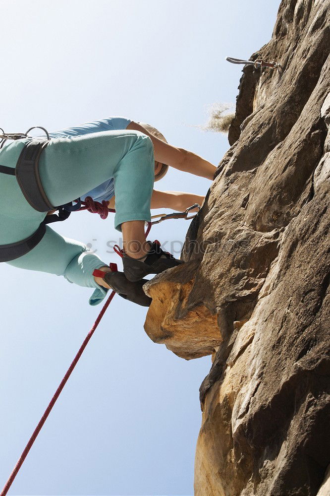 Similar – Climber reaching for a helping-hand.