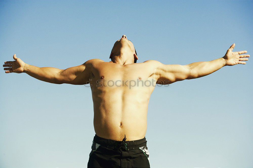 Similar – Young urban athlete warming up before calisthenics training