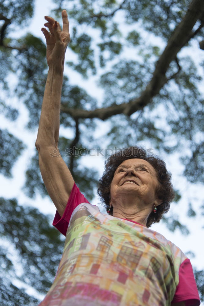 Similar – Senior citizen looks up in the forest