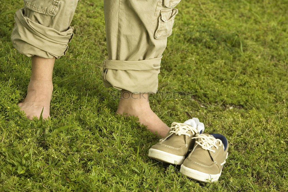 Similar – baby walking barefoot on stones