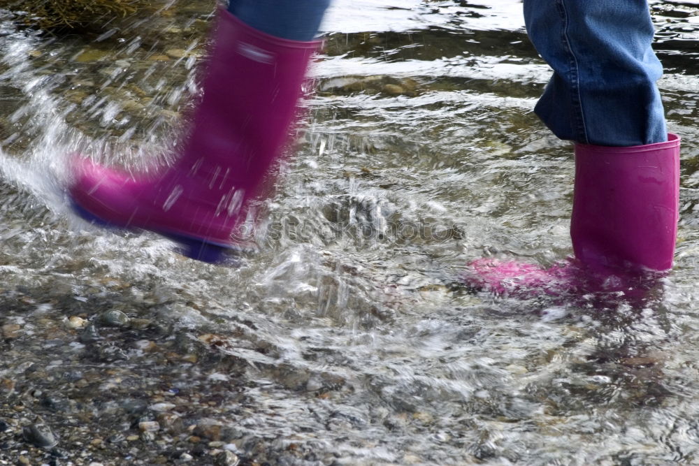 Similar – Rubber Boots Water Splashing