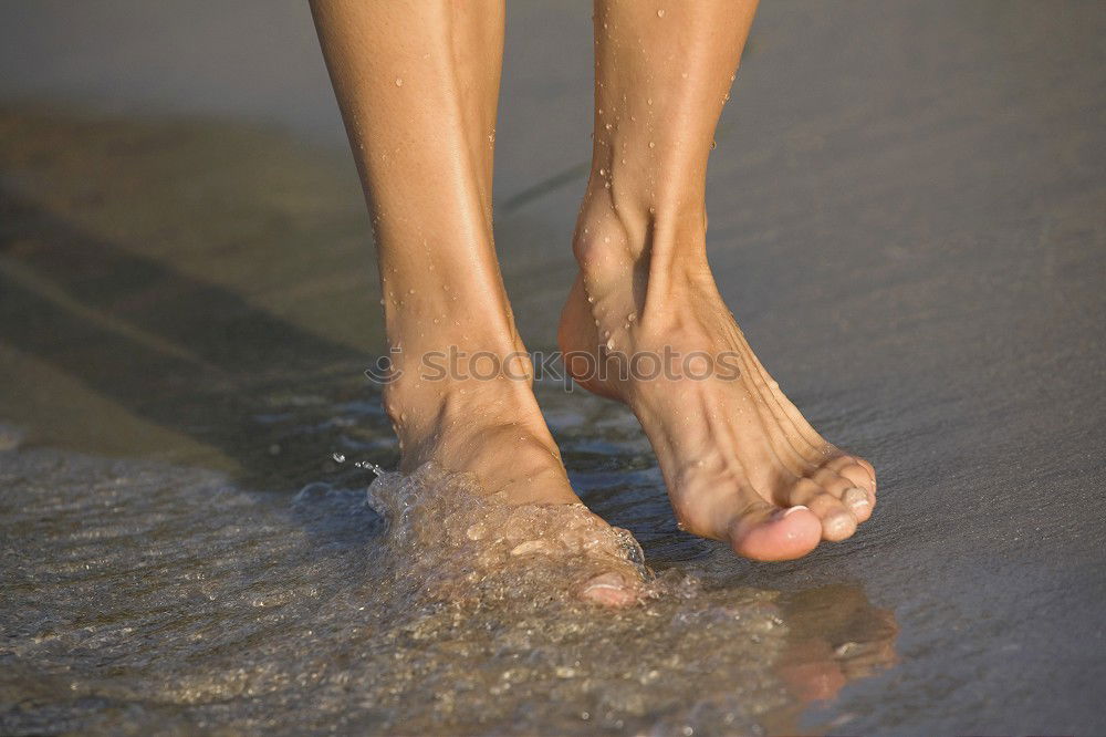 Similar – Barefoot over stick and stone