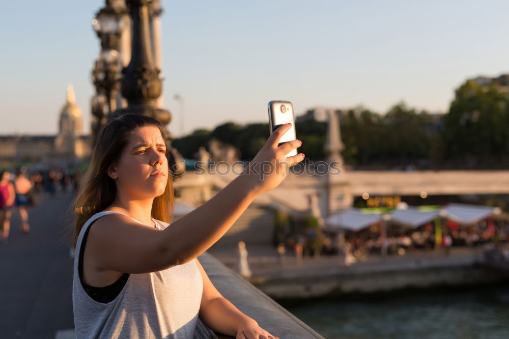 Similar – Image, Stock Photo two friends in the street taking pictures with mobile phone