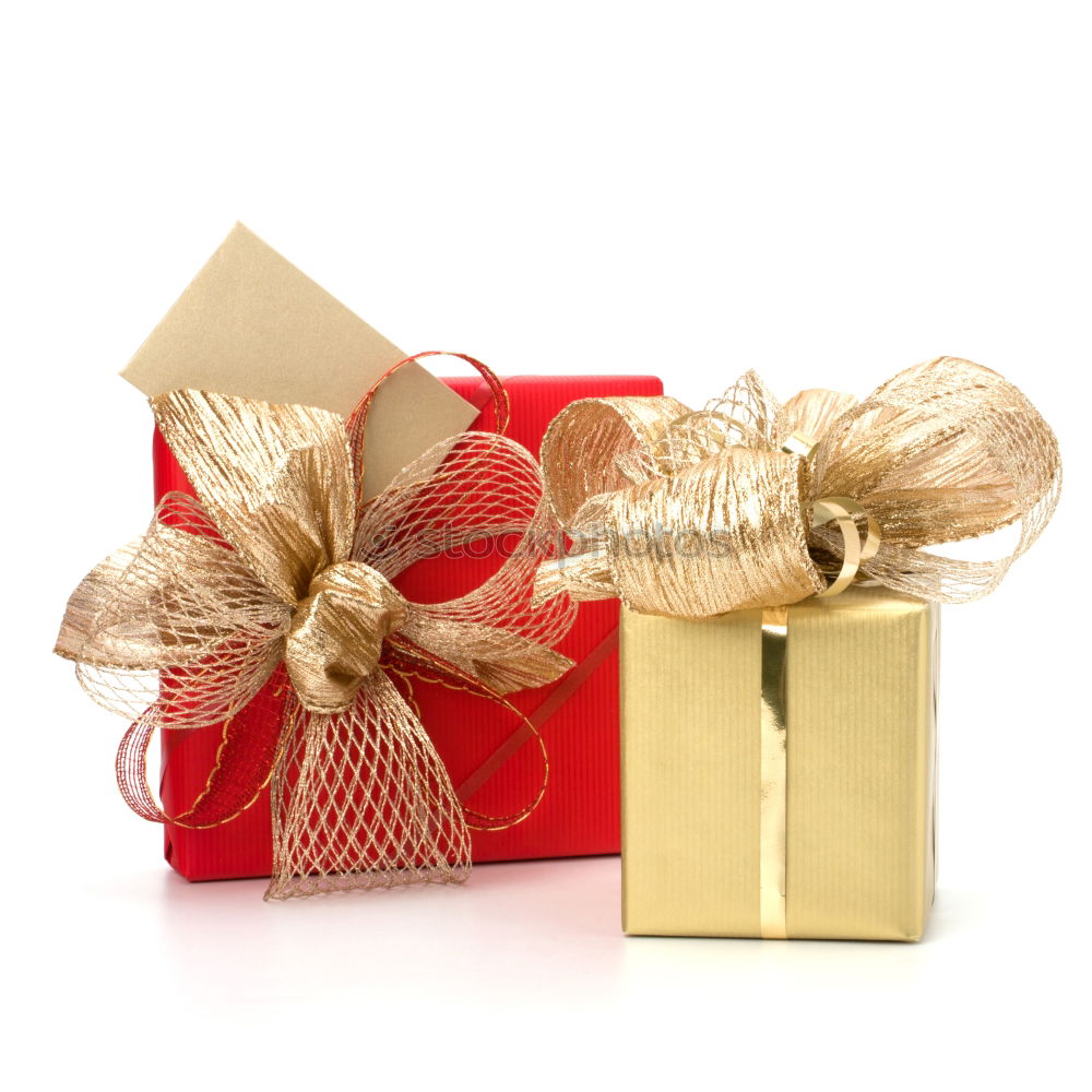 Gift box wrapped in recycled paper, red bow and tag