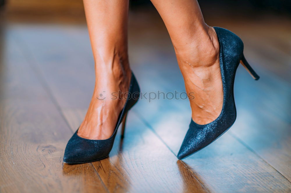 Similar – Ballerinas legs in black pointes on wooden floor in point position