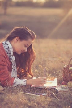 pretty young woman reading a book