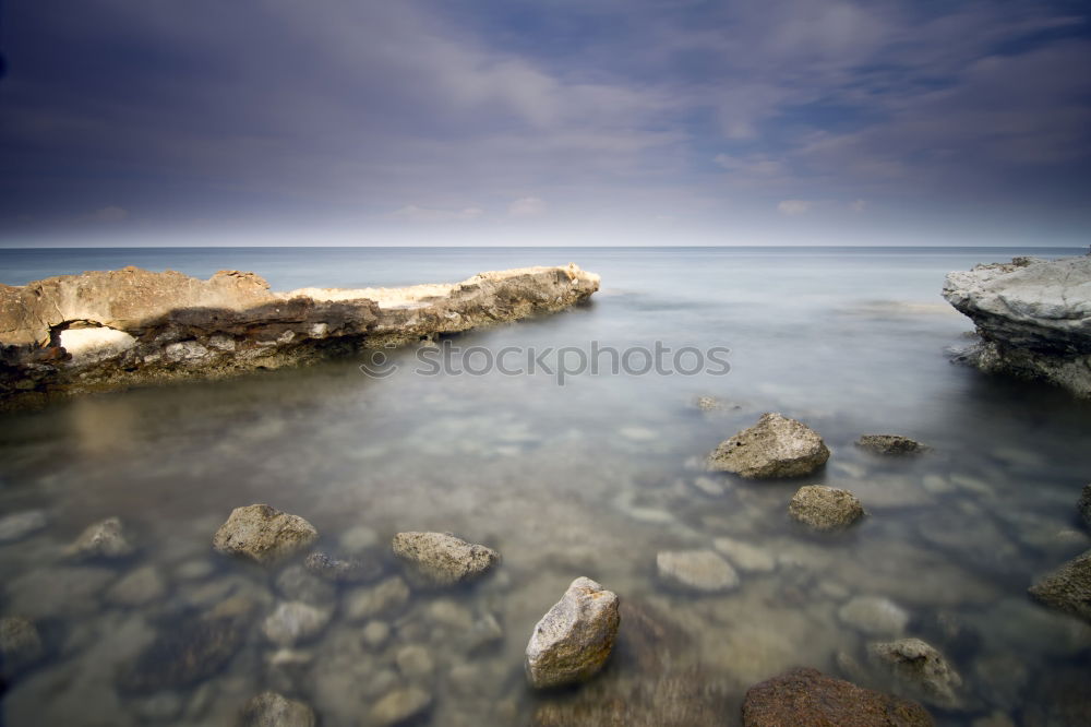 Similar – Rocky coast in the morning light