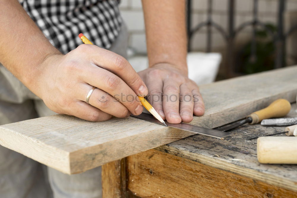 Similar – Image, Stock Photo Carpenter works with a chisel and a hammer.