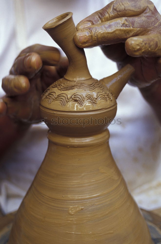 Similar – Image, Stock Photo Close-up of clay vase on wheel