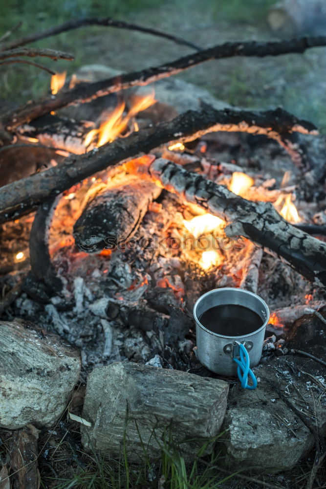 Similar – Making coffee on campfire