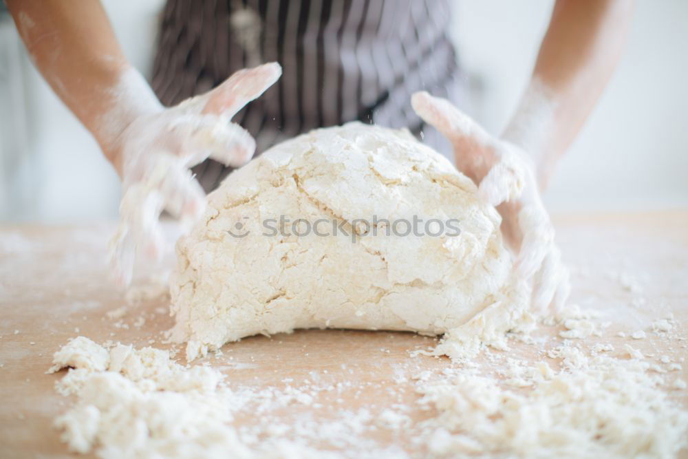 Similar – woman kneading bread dough with her hands