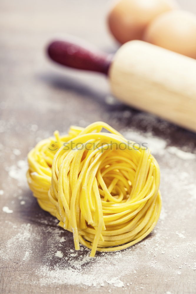 Similar – Image, Stock Photo Making homemade taglatelle with a pasta rolling cutter