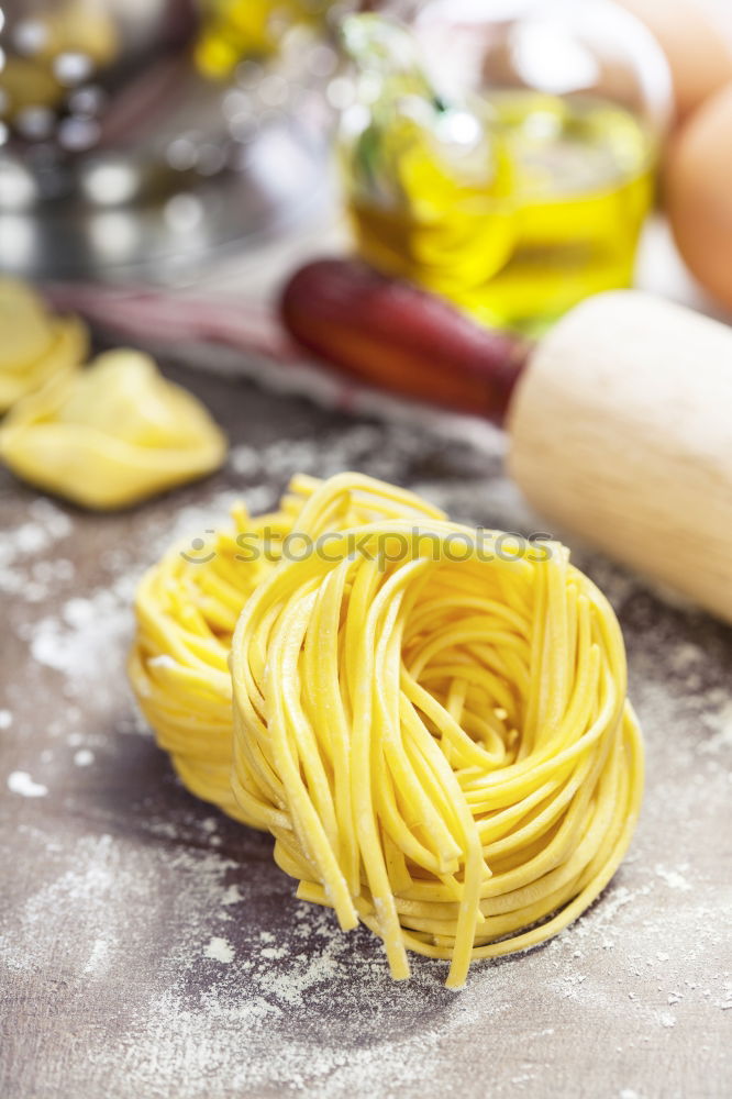 Similar – Image, Stock Photo Making homemade taglatelle with a pasta rolling cutter