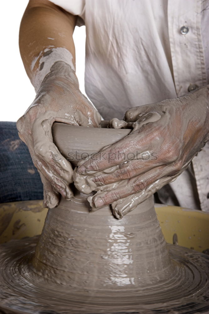 Similar – Image, Stock Photo Potter’s hands making a pot in a traditional style.