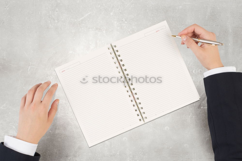 Similar – A woman’s hand holding an empty notebook