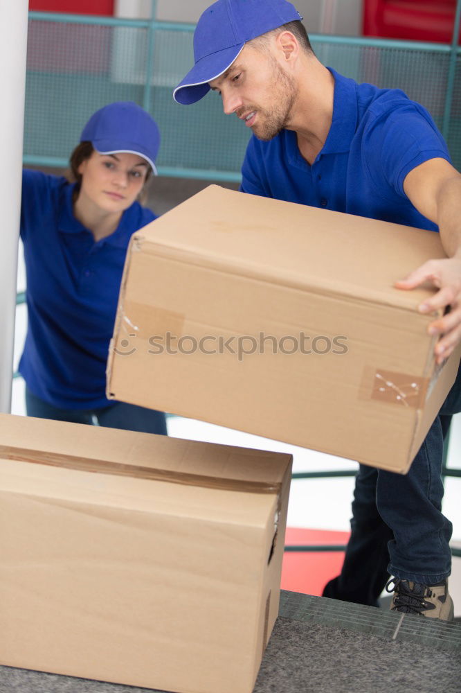 Similar – Man carrying moving boxes