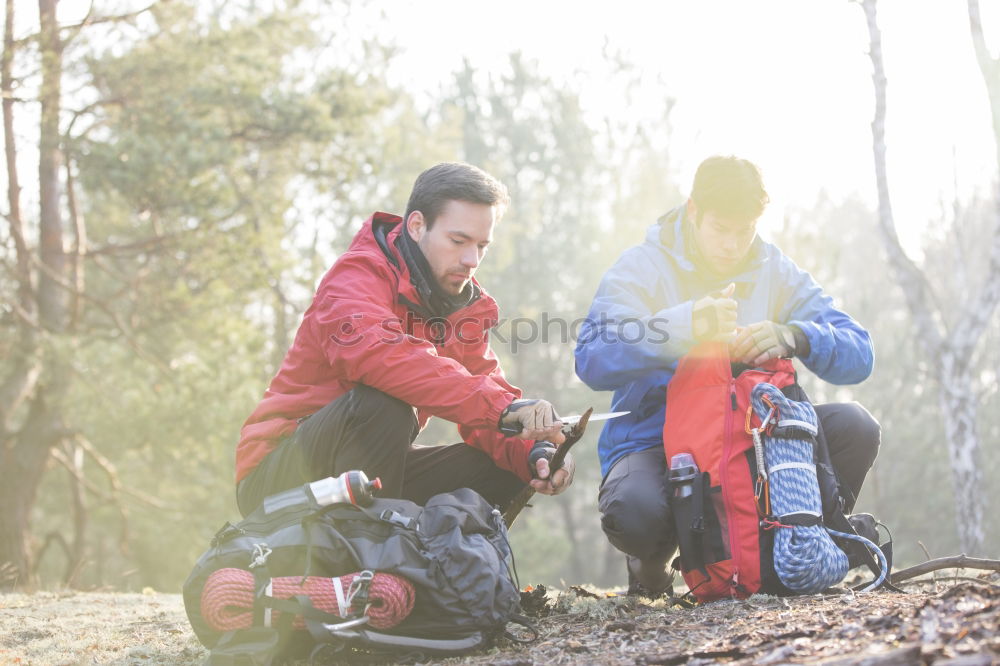 Similar – Image, Stock Photo Couple pausing while doing trekking