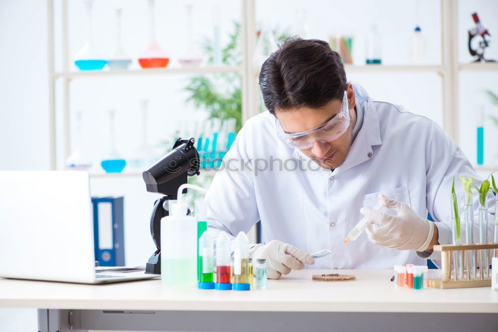 Similar – Image, Stock Photo Woman holding flask in lab