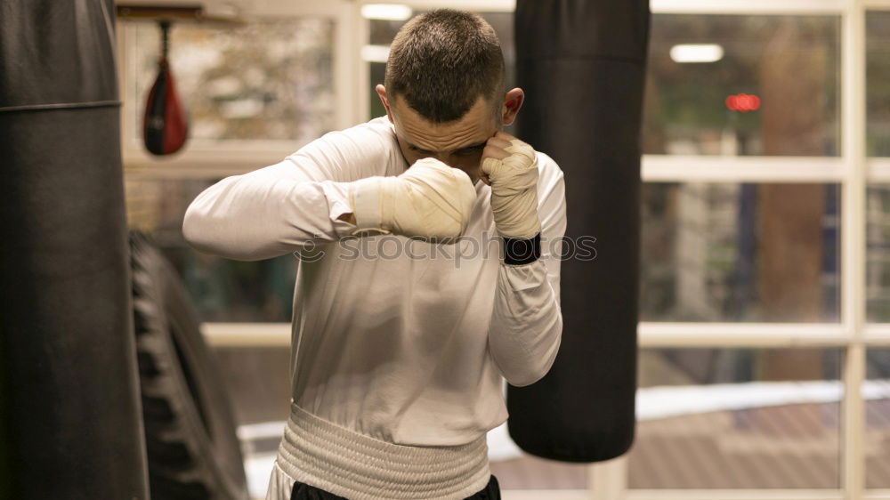 Similar – Image, Stock Photo Young thai boxing man is doing a workout for fight