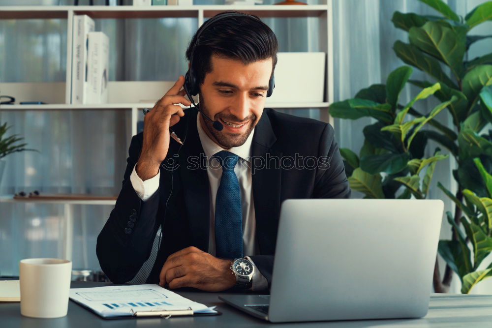 Similar – Image, Stock Photo Handsome businessman with striped tie sits at table with coffee making phone call and using his tablet