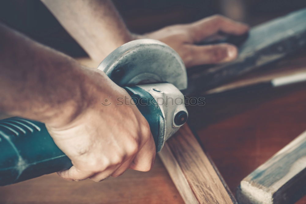 Similar – Man shoeing horse near stable