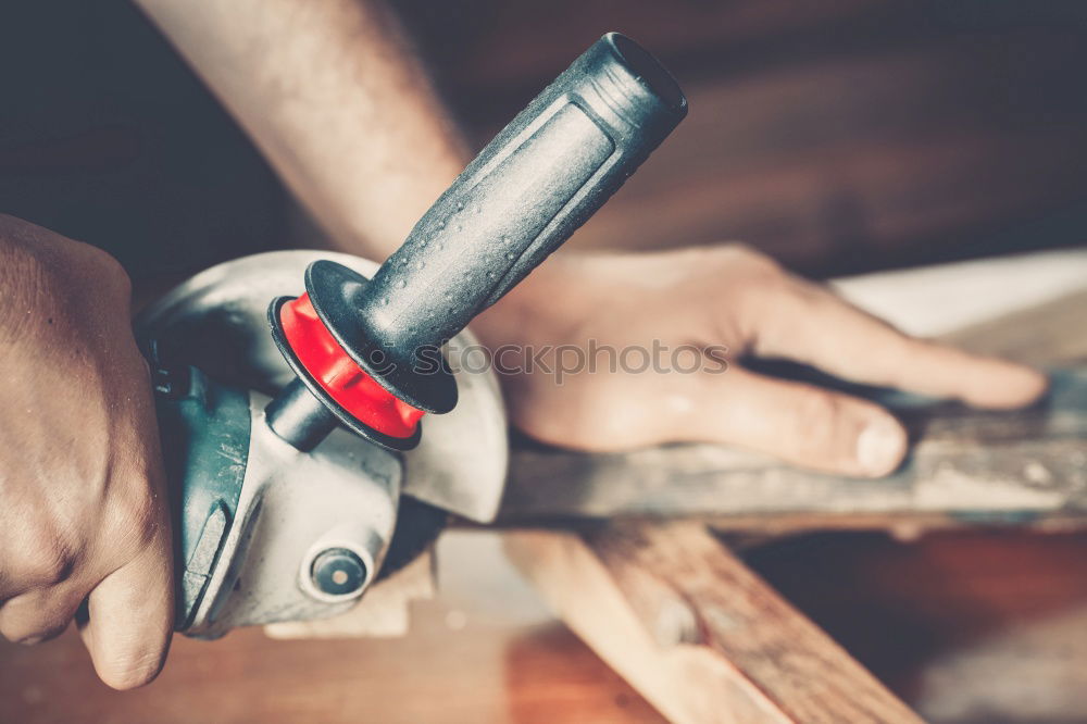 Similar – Man shoeing horse near stable