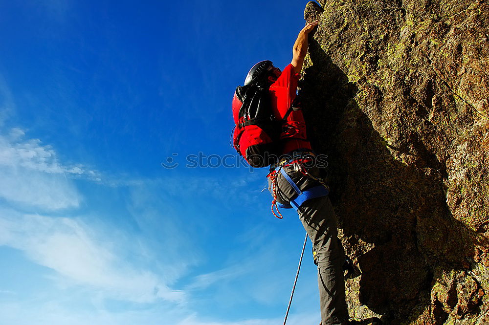 Similar – Image, Stock Photo Rock climber clinging to a cliff.