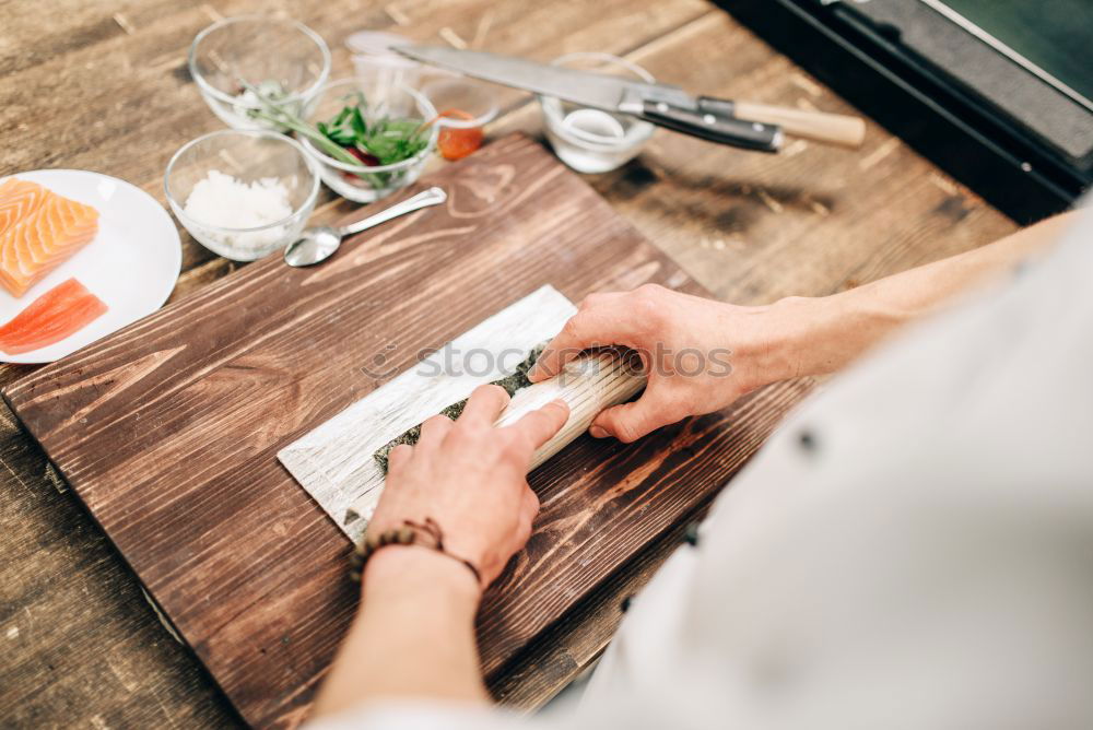 Similar – Crop woman eating sushi