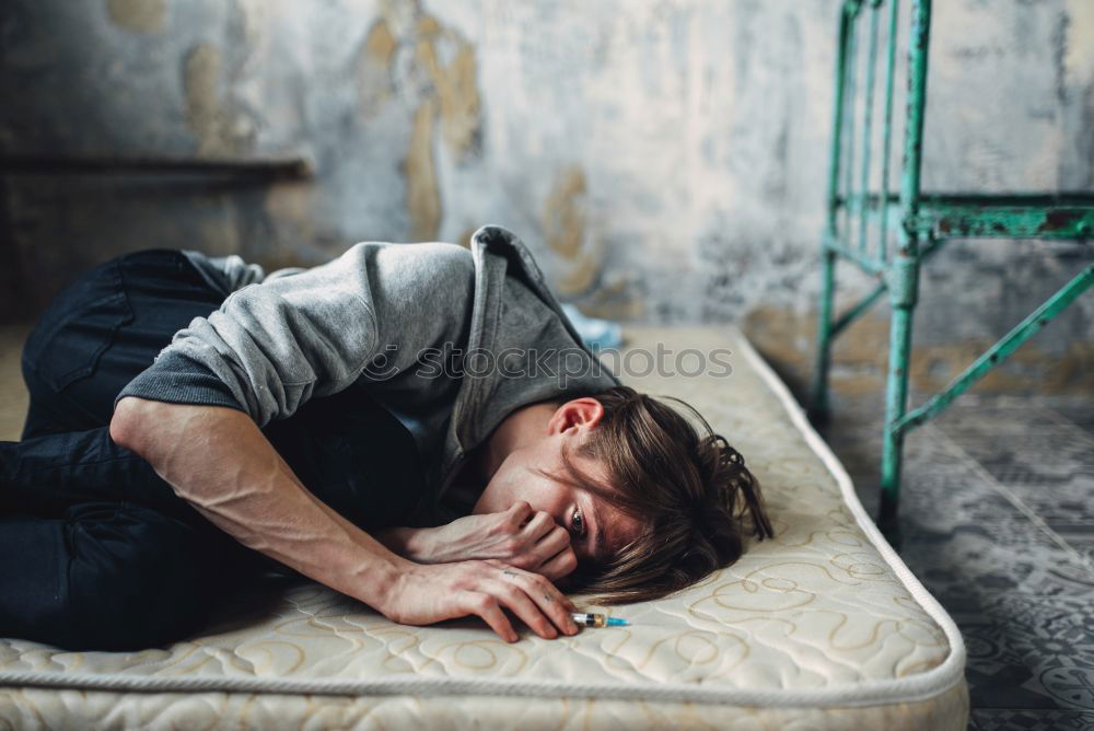 Similar – Young woman sitting on sidewalk in front of abandoned house