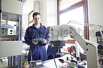 Similar – Image, Stock Photo Young man in lab