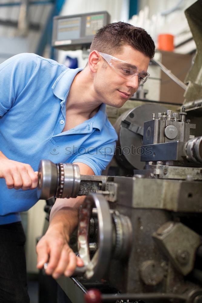 Similar – Professional Mechanic Repairing Car.