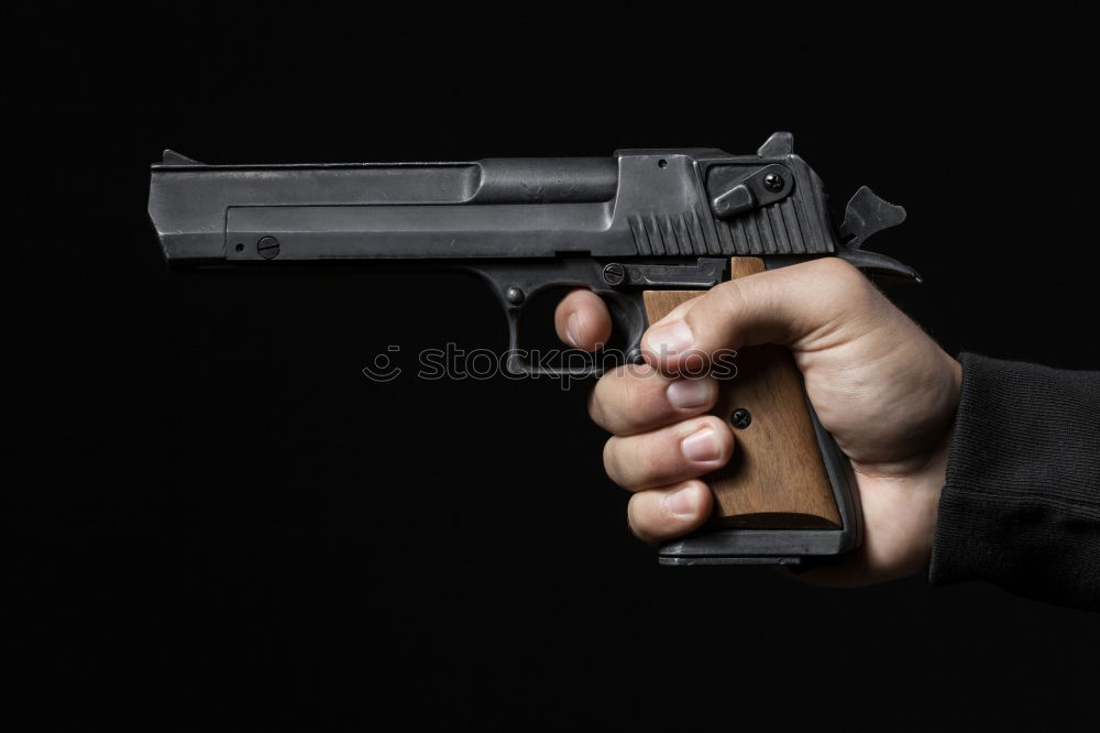 Similar – pistol on pink background