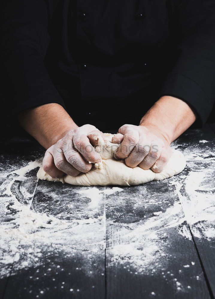 Similar – Image, Stock Photo male hand holding a ceramic plate with yeast dough