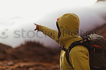 Similar – Image, Stock Photo Boy standing among the dwarf pines on mountain trail